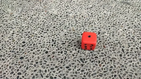 Red dice rolled across the stone floor. Stock Footage 260629938