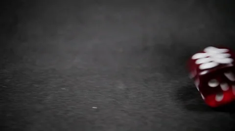 Red dice rolls on black background. Stops on six. Stock Footage 58862768