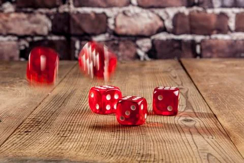 Red Dice on Table Stock Photos
