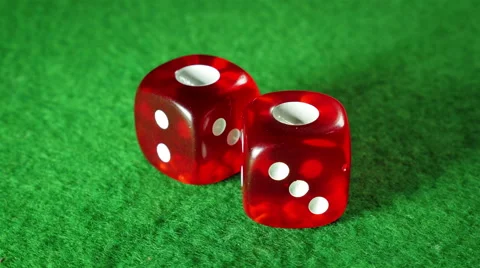 Red dices on the green cloth background. Rotation. Double one. Stock Footage 58614422