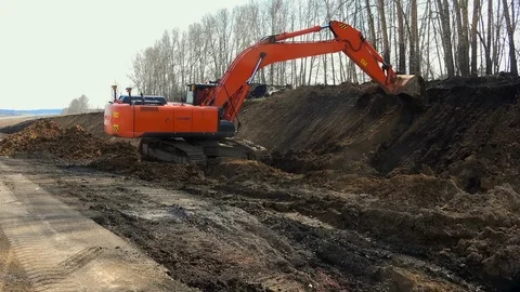 Red digger digs Stock Footage 122825708