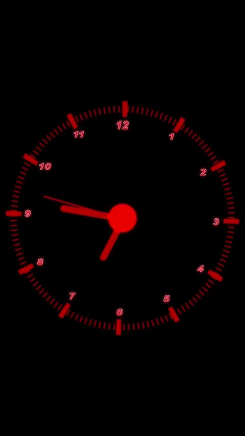 Red Digital Clock Face with Numbers and Hands on a Black Background Keyword.. Stock Footage 337460726