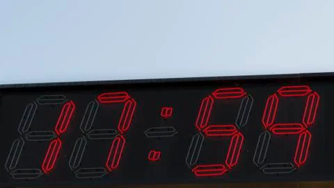 Red digits clock 17.59 Stock Photos