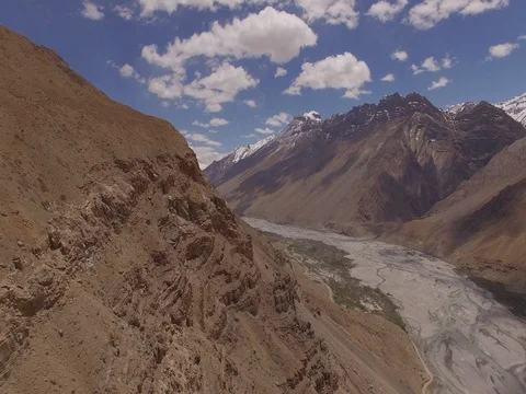 Red Dirt Cliff with Mountains Stock Footage 81003359