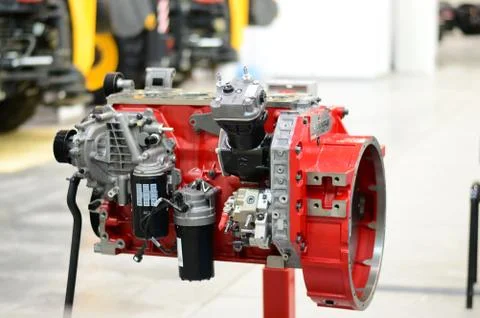 Red disassembled tractor engine stands Stock Photos