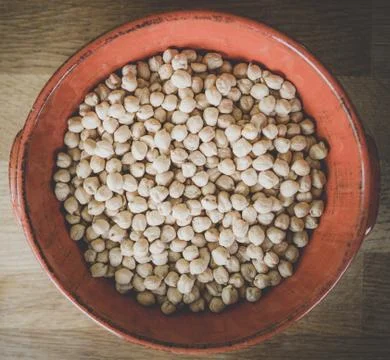 Red dish full of chickpeas, view fro above Stock Photos