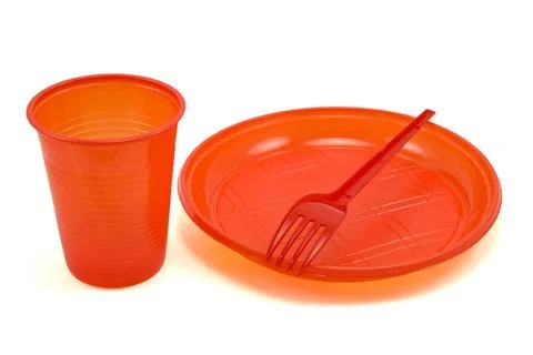 Red disposable tableware red disposable tableware isolated on white backgr... Stock Photos