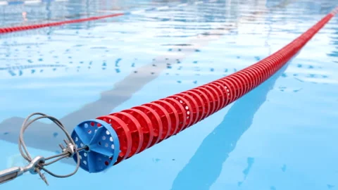 Red dividing strip in the pool, undulating water surface is visible Stock Footage 93461101