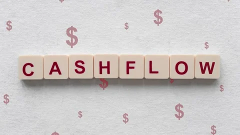 Red Dollar Signs Going Down Behind The Cashflow Word On Scrabble Tiles. Stockbeeldmateriaal 250521443