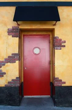 Red door with canopy Stock Photos