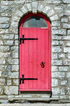 Red door of lighthouse Stock Photos