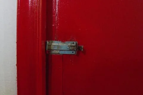 Red door lock. Stock Photos