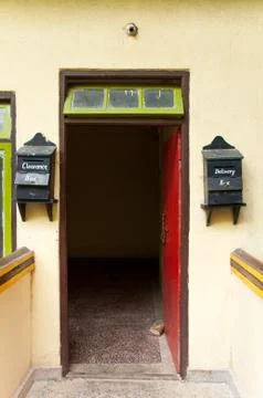 Red door with mail boxes Stock Photos