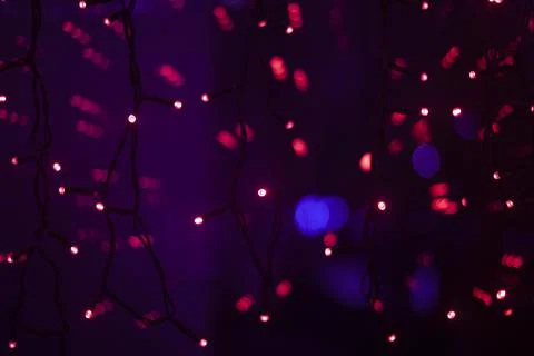 Red dots in space. Lights in dark. Red light bulbs. Lot of small lights in fr Foto stock
