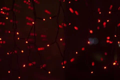 Red dots in space. Lights in dark. Red light bulbs. Lot of small lights in .. Stock Photos