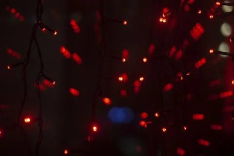 Red dots in space. Lights in dark. Red light bulbs. Lot of small lights in .. Stock Photos