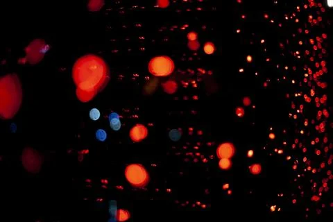 Red dots in space. Lights in dark. Red light bulbs. Lot of small lights in .. Stock Photos