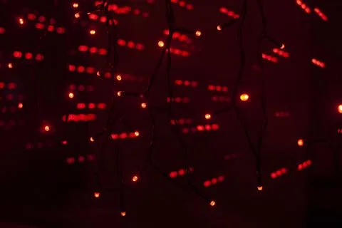 Red dots in space. Lights in dark. Red light bulbs. Lot of small lights in .. Stock Photos