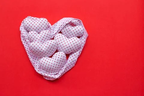 Red dots on white heart shape, Valentine's hearts on red background Foto stock