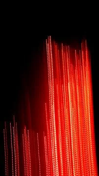 Red dotted lines of lights on a black background Stock Illustration