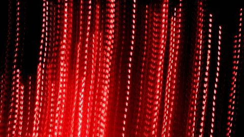Red dotted lines of lights on a black background Stock Photos