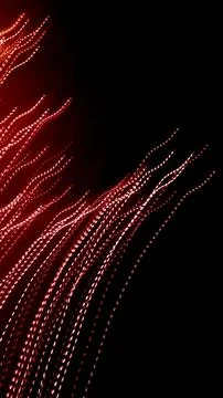 Red dotted lines of lights on a black background Stock Photos