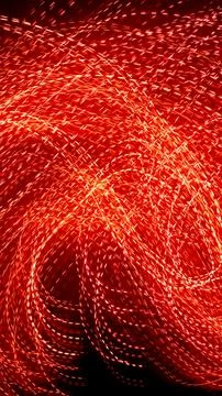 Red dotted lines of lights on a black background Stock Photos