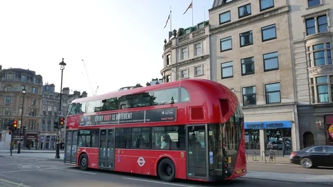 Red Double-Decker Bus And Sport Cars On The Road In London, United Kingdom Stock Footage 83574719