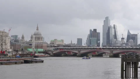 Red double-decker bus crossing blackfriars bridge in London Stock Footage 289013296