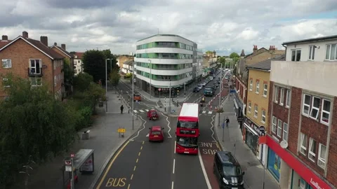 Red double decker bus driving in street, connecting of two one-way roads Stock-Footage 161291779