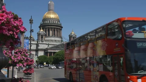Red Double-decker bus moves on a street on Isaac's cathedral background Stock Footage 77452010