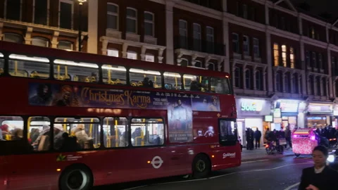Red Double Decker Bus In Nighttime London Street Tracking Shot Stock Footage 327654909