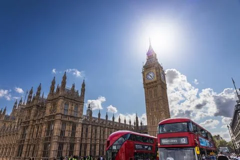 Red double-decker bus passing Big Ben. London, UK, 9 July 2023 写真素材