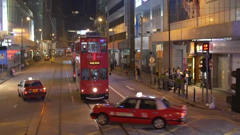 A Red Double-decker Bus On The Street and cars passing by at Night in Winter Stock Footage 144041566