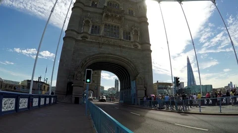 Red double-decker bus on Tower Bridge and The Shard in the background, London Stock Footage 79507969