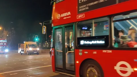 Red double decker buses driving through London, 4K Stock Footage 123246829
