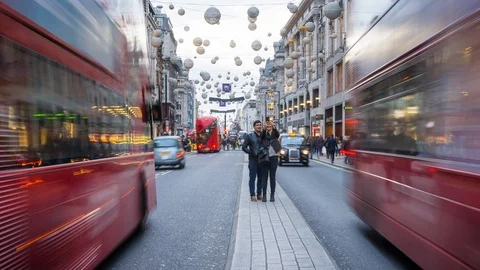 Red double-decker buses on Oxford Street, Christmas decorations, Time lapse Stock Footage 106681342