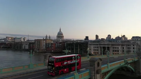 Red double-decker driving on Southwark Bridge over Thames river Stock-Footage 157437006