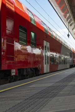 Red Double-Decker Passenger Train at Modern Station Platform Stock Photos