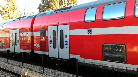 Red double decker train arriving at the station in Binyamina Israel Stock Footage 59509974