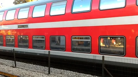 Red double decker train leaving the station in Binyamina Israel Stock Footage 59514666