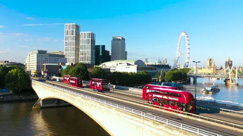 Red double-deckers driving on Waterloo Bridge Stock Footage 157445964