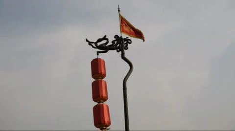 Red dragon flag along and Lantern in the top of Xian City Wall Stock Footage 882810