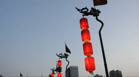 Red dragon flag along and Lantern in the top of Xian City Wall Stock Footage 885798