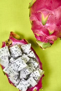Red dragon fruit Set with appetizing serving on green background. Top view Stock Photos