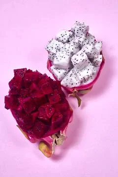 Red dragon fruit Set with appetizing serving on pink background. Top view Stock Photos