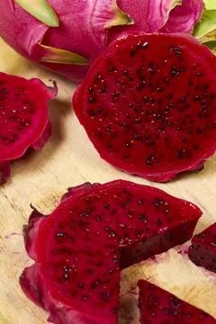 Red dragon fruit Set with appetizing serving on green background. Top view Stock Photos