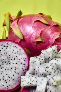 Red dragon fruit Set with appetizing serving on green background. Top view Stock Photos