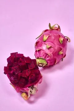 Red dragon fruit Set with appetizing serving on pink background. Top view Stock Photos