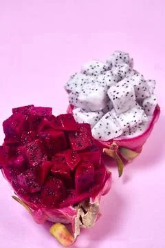Red dragon fruit Set with appetizing serving on pink background. Top view Stock Photos